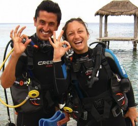 Two young first-time divers getting ready to dive