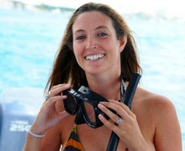 Snorkeler ready to don her dive mask