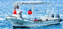 Speedboat captain proudly waving from calm waters